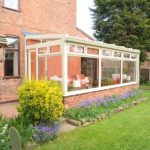 A Lean To Conservatory in Beeston, Nottingham, with a glass roof in a cream PVCu.
