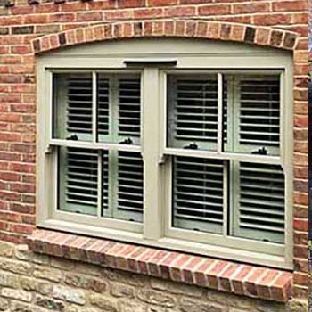 a pale green hardwood sash window from Acorn Windows in Nottingham