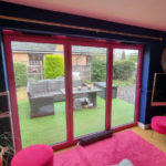 Statement Pink Bi-Fold Doors by Acorn Windows