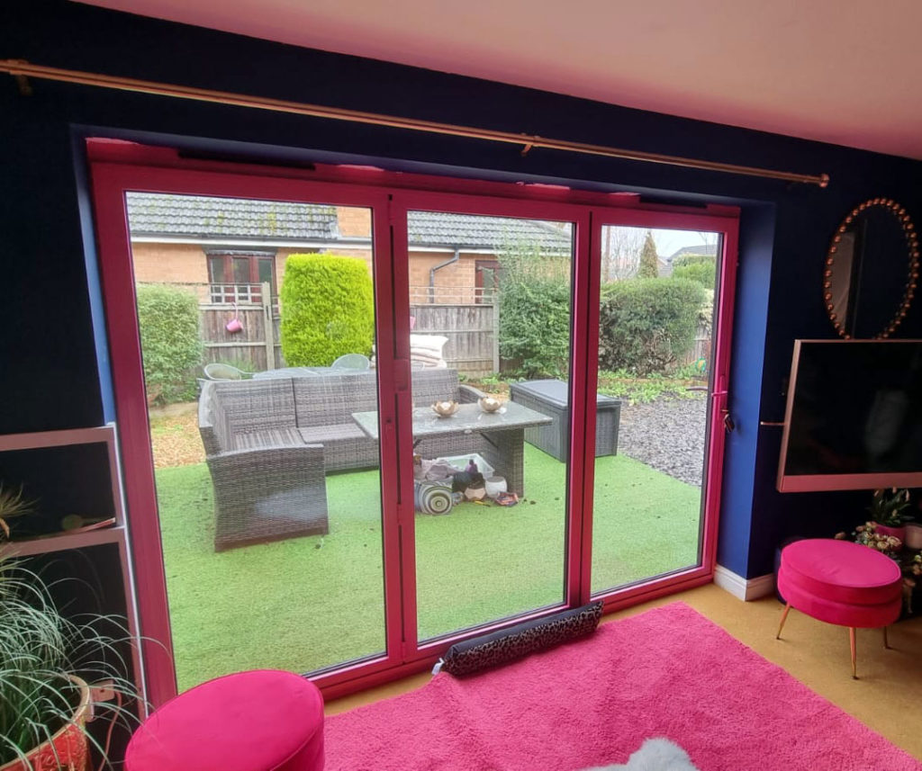 Statement Pink Bi-Fold Doors by Acorn Windows