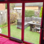 Statement Pink Bi-Fold Doors by Acorn Windows